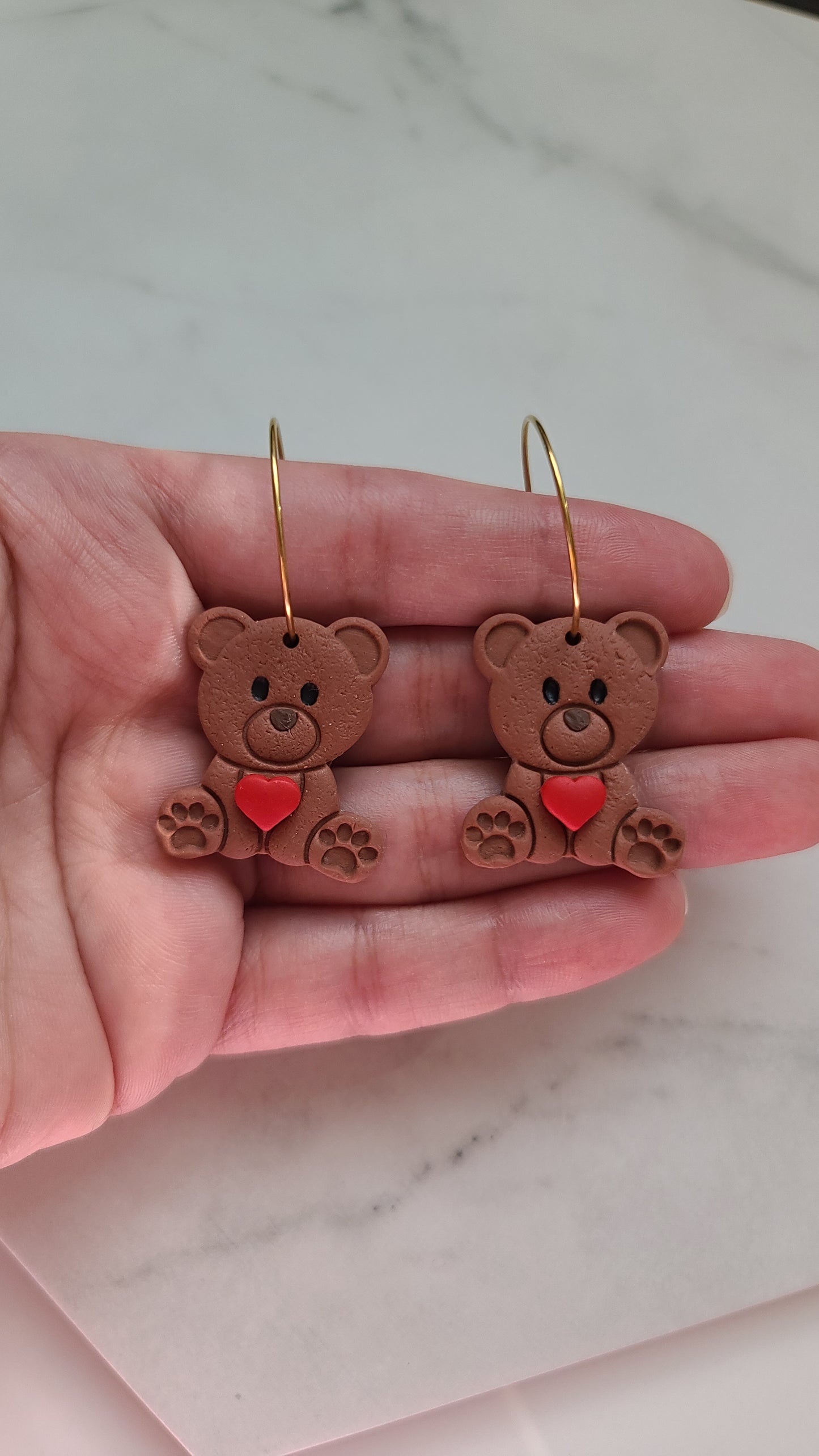 Teddy bear with heart earrings